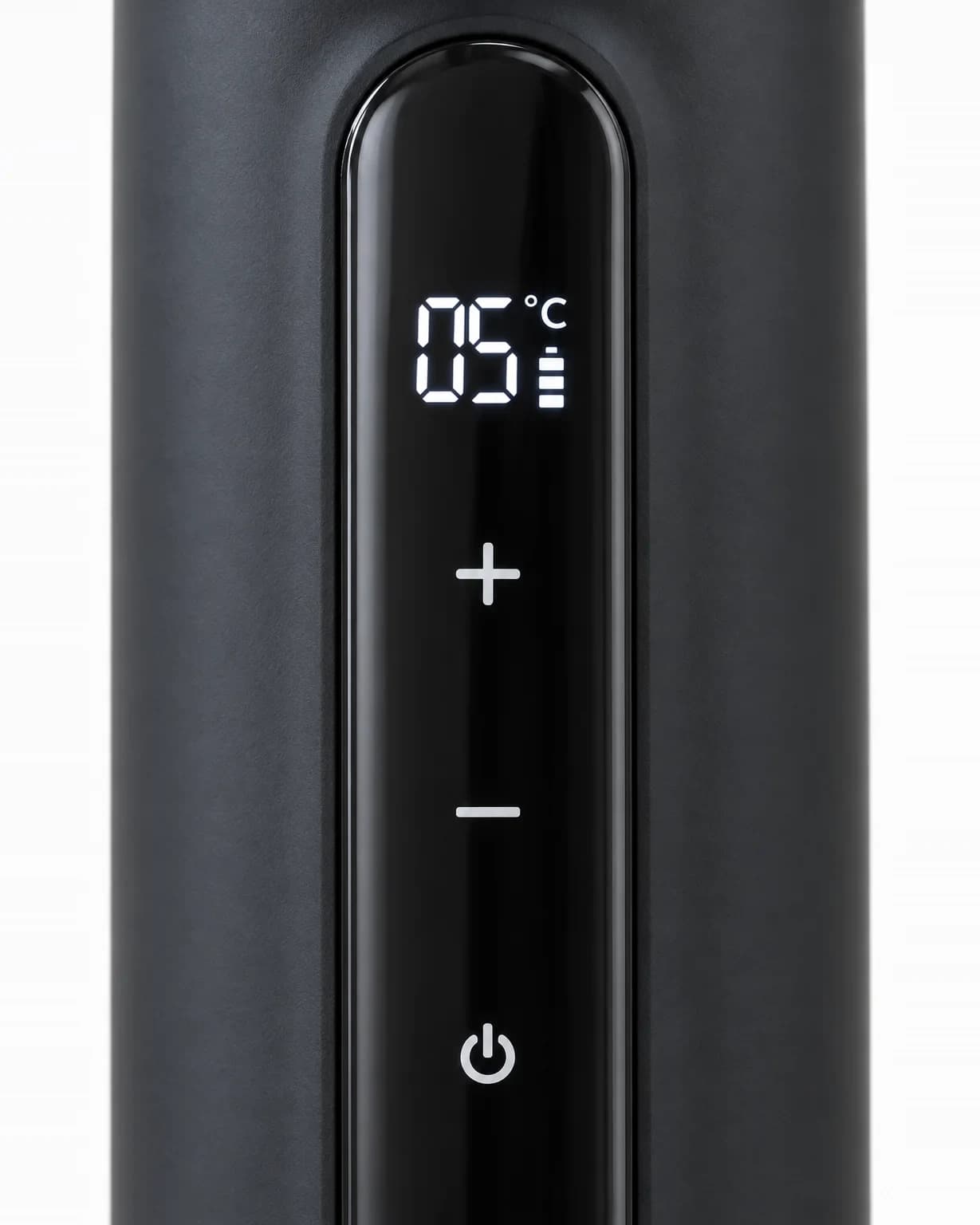 Close-up of the glossy front display reading 05°C, with plus, minus and power buttons below